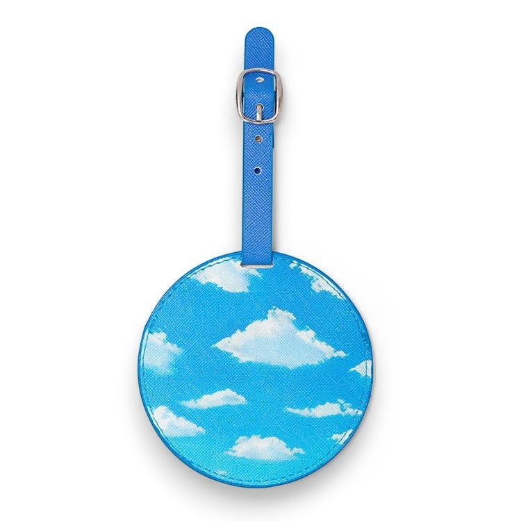Mellow Monkey round blue cloud-patterned PU luggage tag with a zinc buckle strap for travel identification.