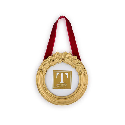 Mellow Monkey round gold holly leaves hanging photo frame ornament with a festive red velvet ribbon.