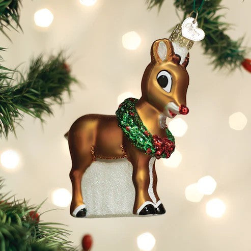 Mellow Monkey Rudolph The Red-Nosed Reindeer blown glass ornament with a green wreath and red nose.