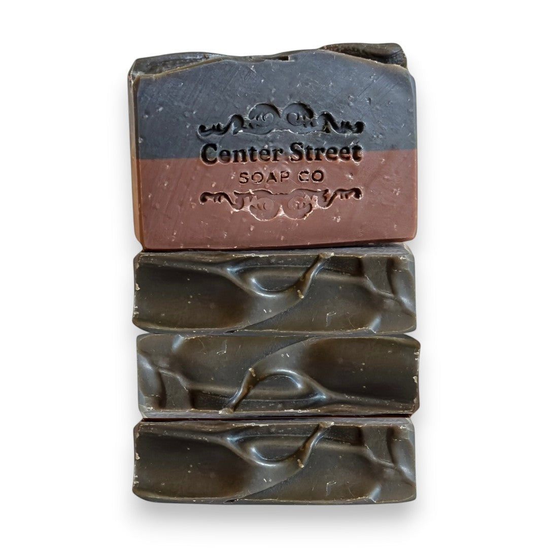 Mellow Monkey Rugged handmade vegan bar soap for men, dark grey and brown, 4-oz bars with embossed logo.