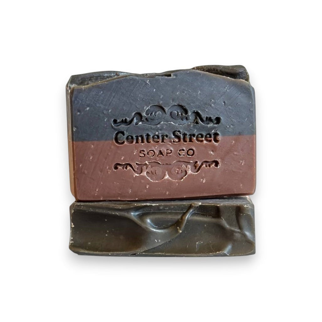 Mellow Monkey Rugged vegan handmade bar soap for men, two-tone brown and black with embossed logo.
