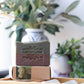 Mellow Monkey Rugged vegan handmade bar soap for men, 4-oz. Two-tone green and brown bar with embossed logo.