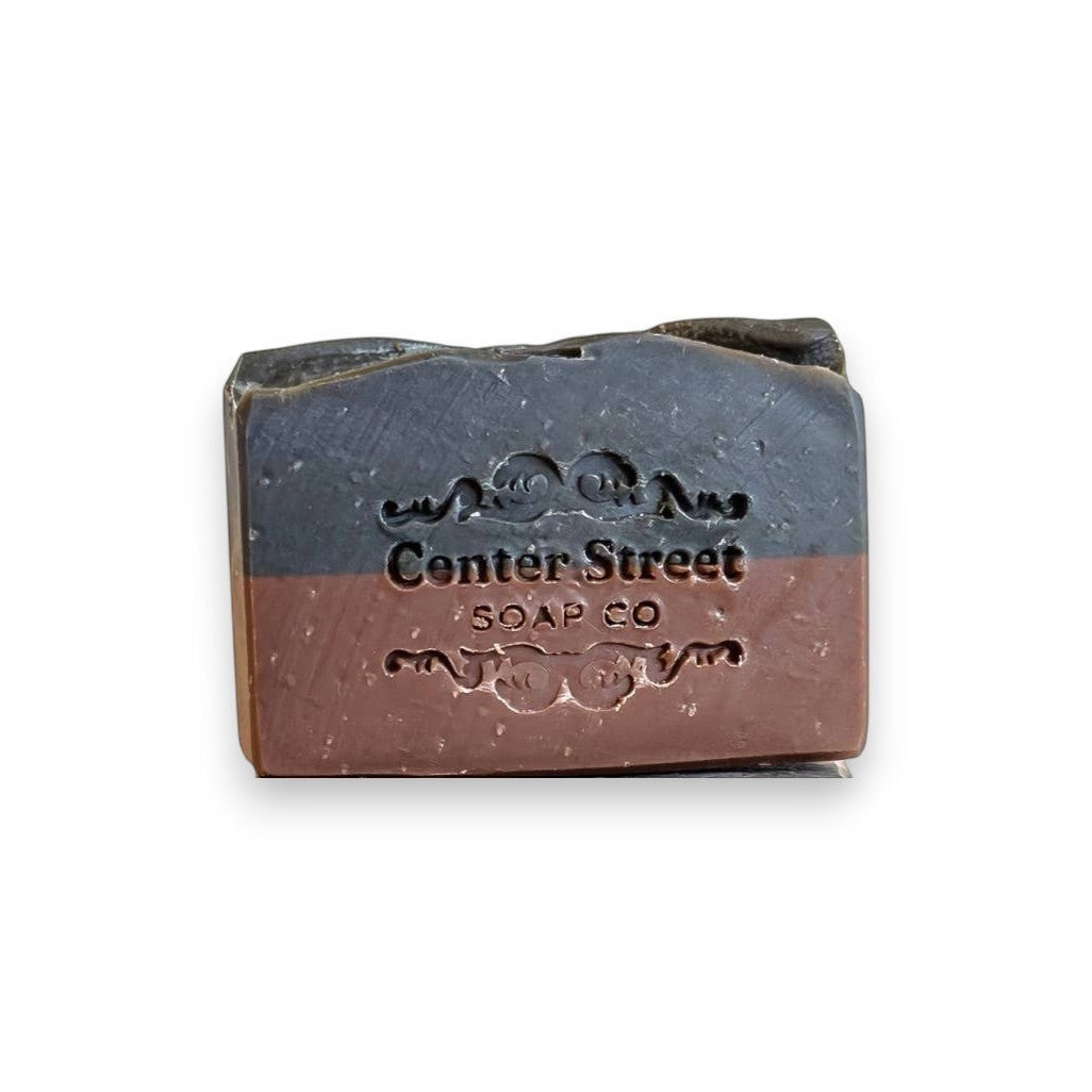 Mellow Monkey Rugged vegan handmade bar soap for men, 4-oz, with a woodsy scent. Two-toned brown and charcoal.