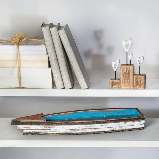 Mellow Monkey rustic wooden boat with distressed blue interior and white exterior, red accent. Coastal decor.