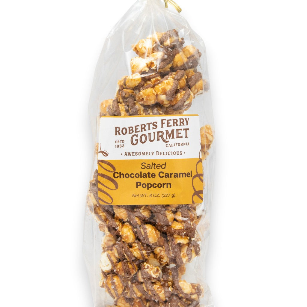 Mellow Monkey Roberts Ferry Gourmet salted chocolate caramel popcorn in a clear 8-oz bag with a branded label.