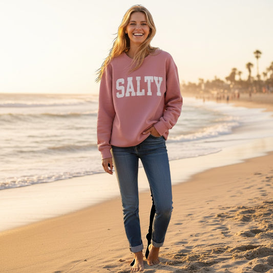 Mellow Monkey Salty Graphic Sweatshirt in Nantucket Mauve. Cozy crewneck with bold white SALTY graphic. Relaxed fit.