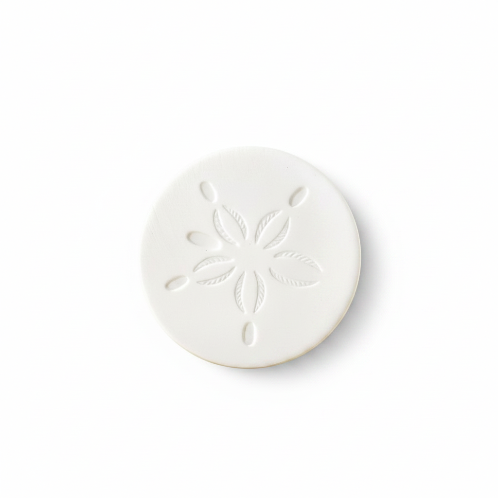 Mellow Monkey white stone coaster featuring a detailed sand dollar design for coastal home decor