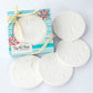 Mellow Monkey By the Shore set of four round white sandstone coasters with embossed sand dollar designs