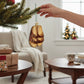 Mellow Monkey Old World Christmas blown glass sandal ornament, 4-inch, with gold glitter and brown straps.