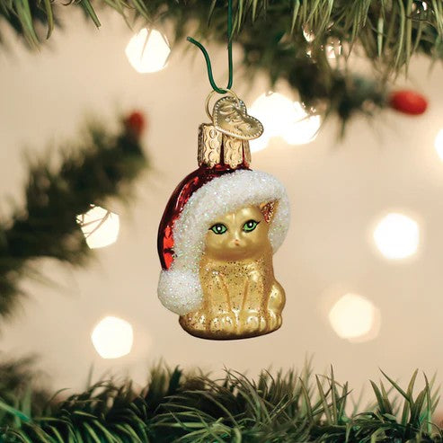 Mellow Monkey Mini Santa's Kitten glass ornament with green eyes wearing a Santa hat with glitter.