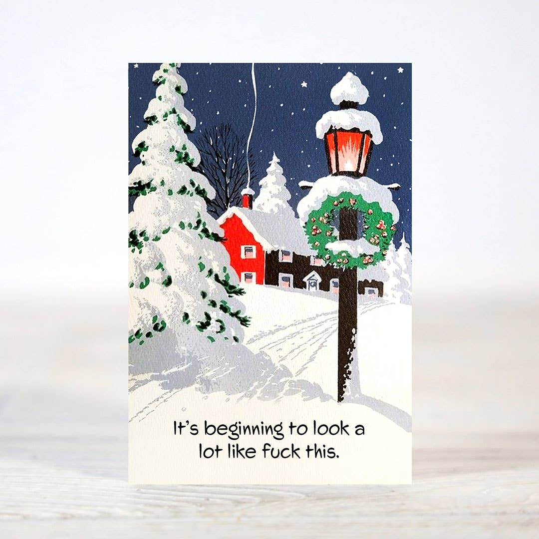 Mellow Monkey sarcastic Christmas card featuring a snowy winter scene with a lamp post and a red house at night.