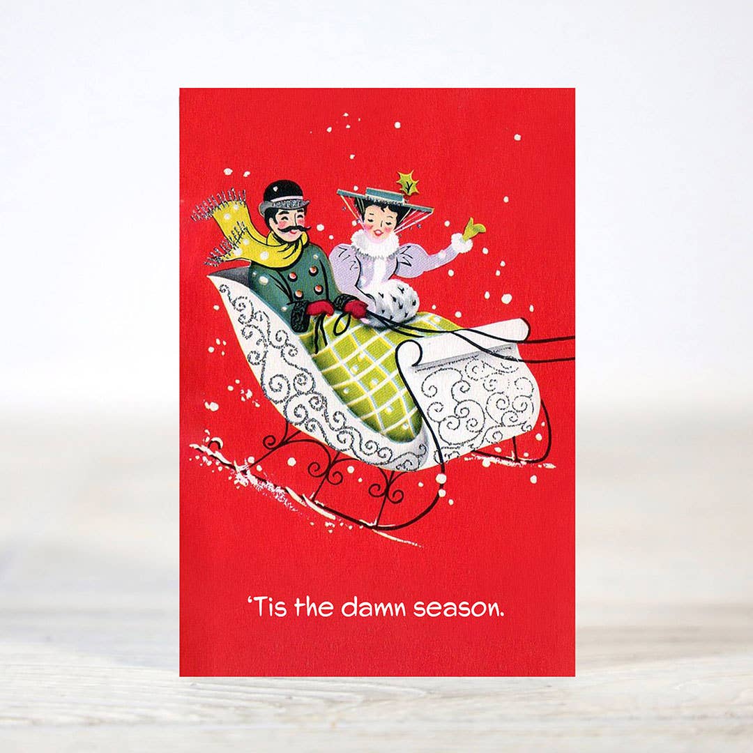 Mellow Monkey sarcastic Christmas card featuring a vintage-style illustration of a couple riding in a red sleigh.