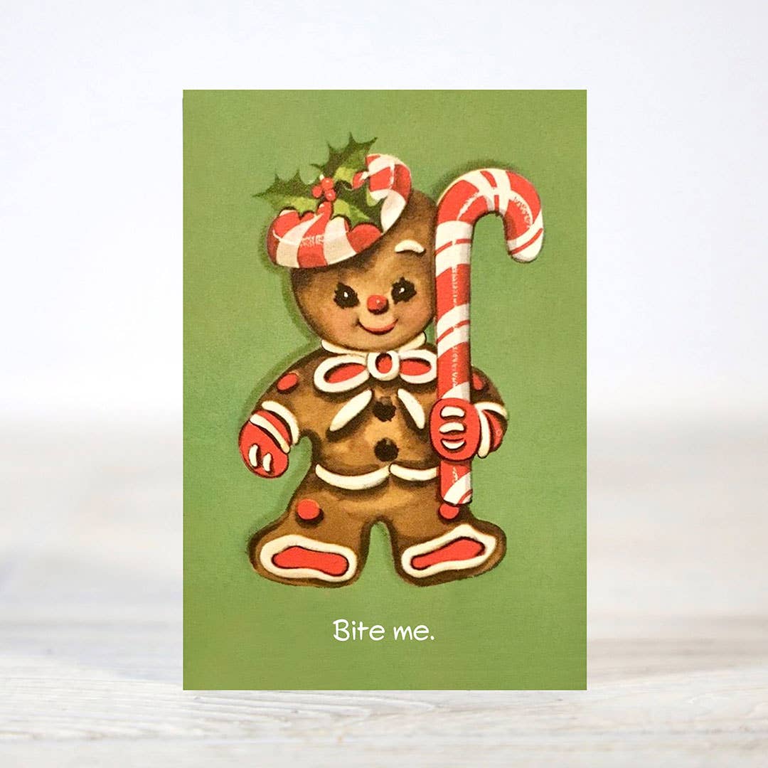 Mellow Monkey sarcastic Christmas card featuring a gingerbread man holding a candy cane on a green background
