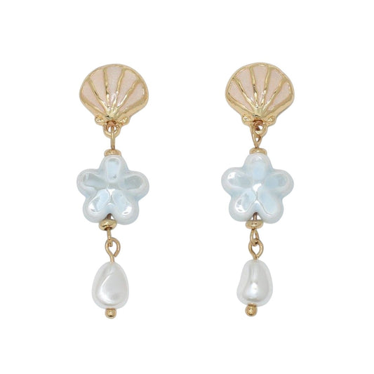 Mellow Monkey scallop shell earrings featuring light blue ceramic flowers and white pearl drops in gold-tone metal.