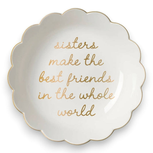 Mellow Monkey white ceramic scallop trinket tray with gold lettering that reads "Sisters make the best friends in the whole world."