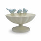 Mellow Monkey decorative scalloped metal bowl in cream with three light blue cast iron birds perched on the rim.