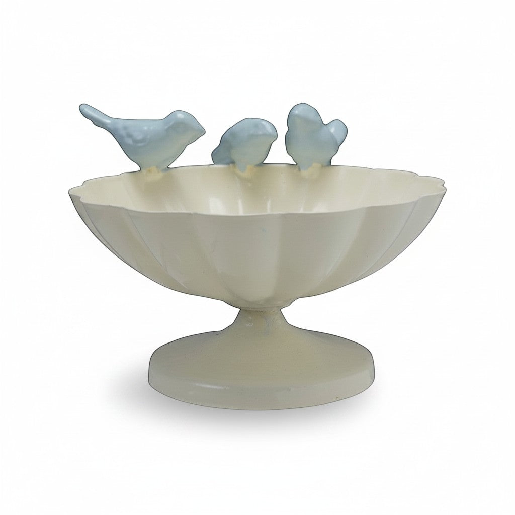 Mellow Monkey decorative scalloped metal bowl in cream with three light blue cast iron birds perched on the rim.