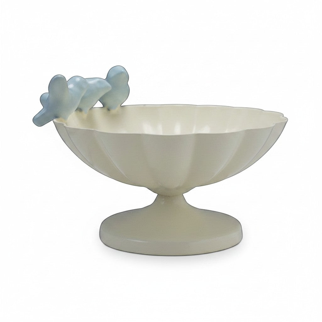 Mellow Monkey decorative scalloped cream metal bowl with three light blue cast iron birds on rim.