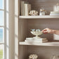 Mellow Monkey decorative scalloped bowl in cream with three light blue cast iron birds perched on the rim.