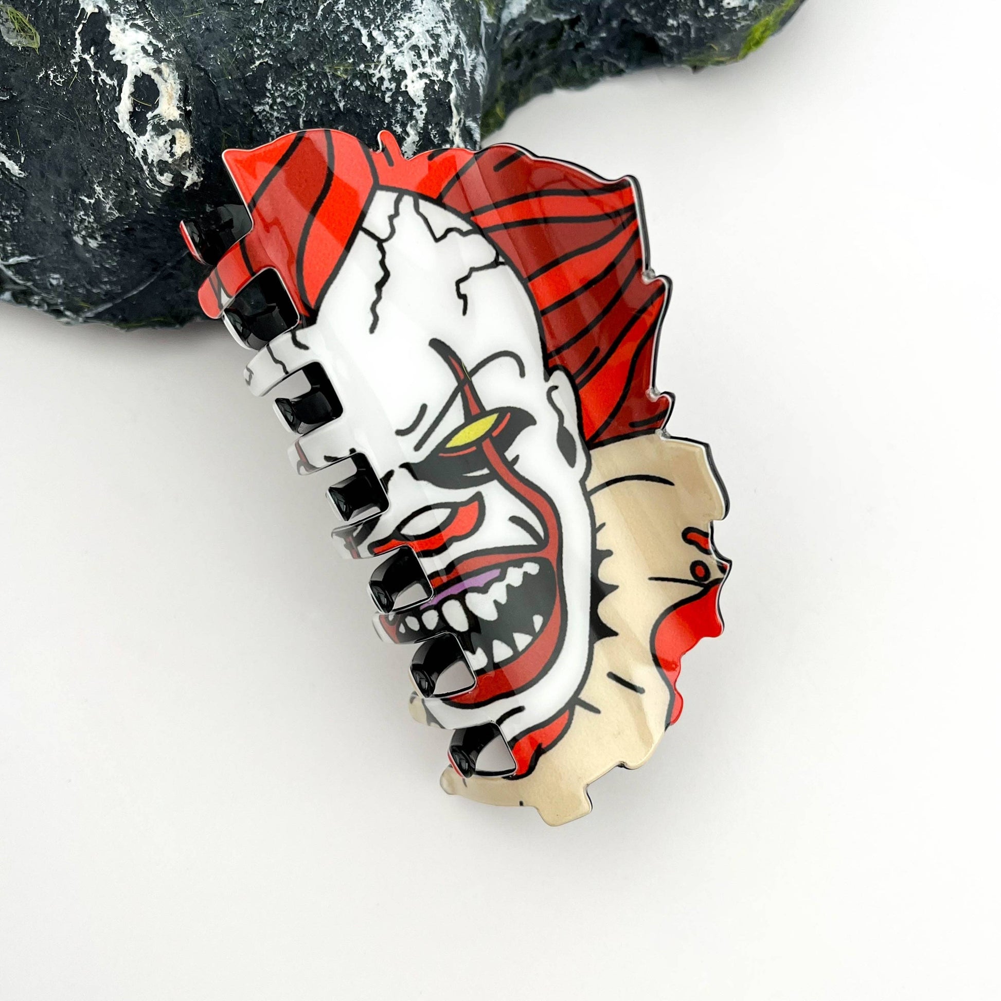 Mellow Monkey scary clown Halloween claw hair clip with red hair and white face paint details.