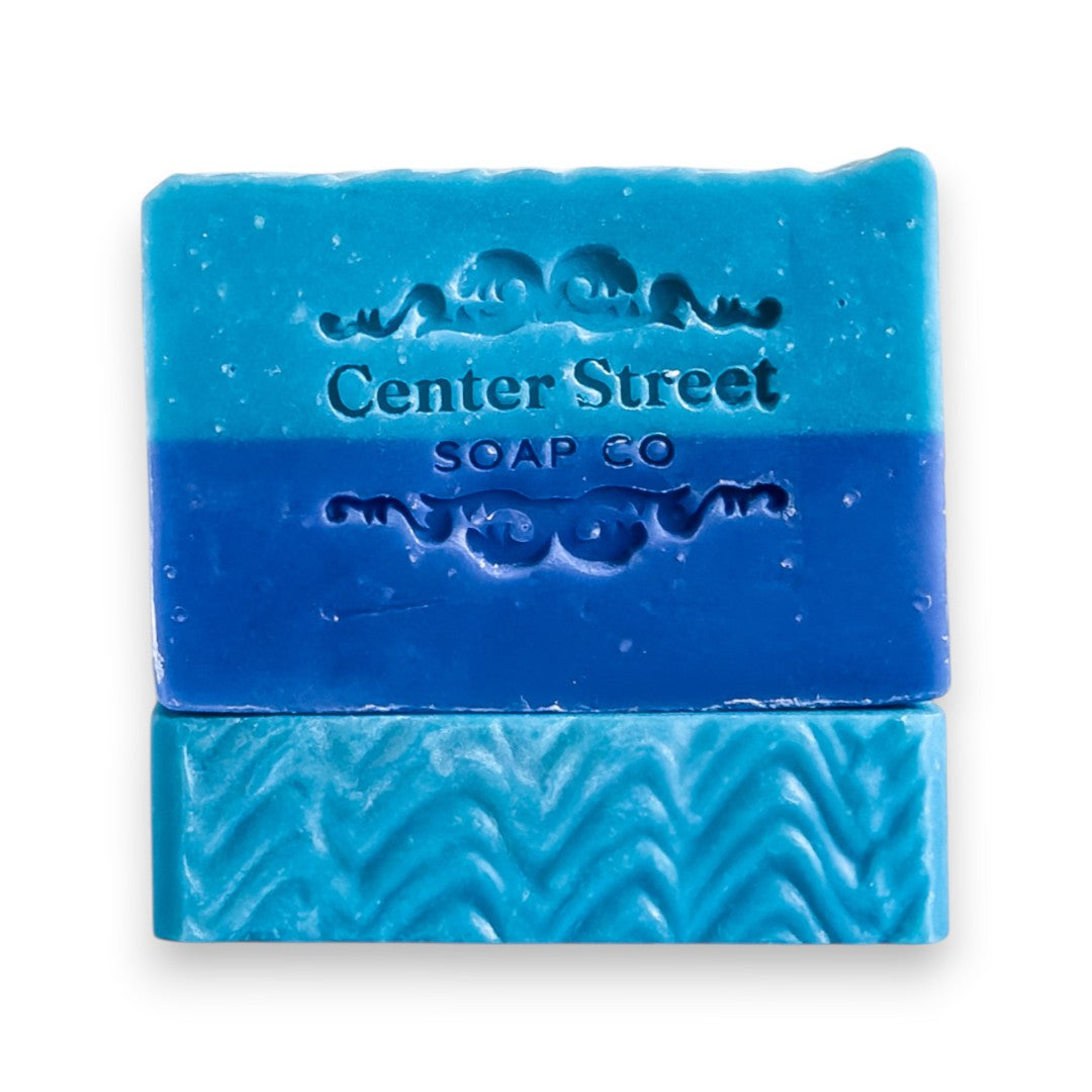 Mellow Monkey Sea Captain handmade vegan bar soap, blue and teal with embossed waves and "Center Street Soap Co."