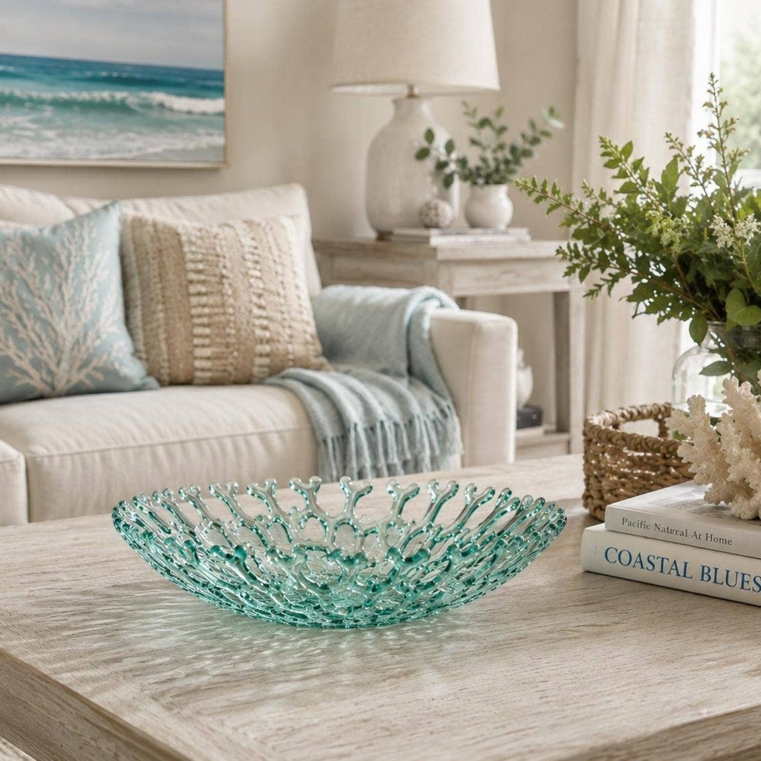 Mellow Monkey sea foam glass coral bowl centerpiece on a wooden coffee table in a coastal living room.
