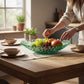 Mellow Monkey handmade sea foam glass coral bowl filled with fresh fruit on a wooden dining table