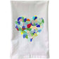 Mellow Monkey white cotton flour sack towel featuring a colorful mosaic heart made of sea glass pieces
