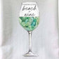 Mellow Monkey Sea Glass Beach & Wine Glass Flour Sack Kitchen Towel, 100% cotton, white with graphic of wine glass filled with sea glass and text.