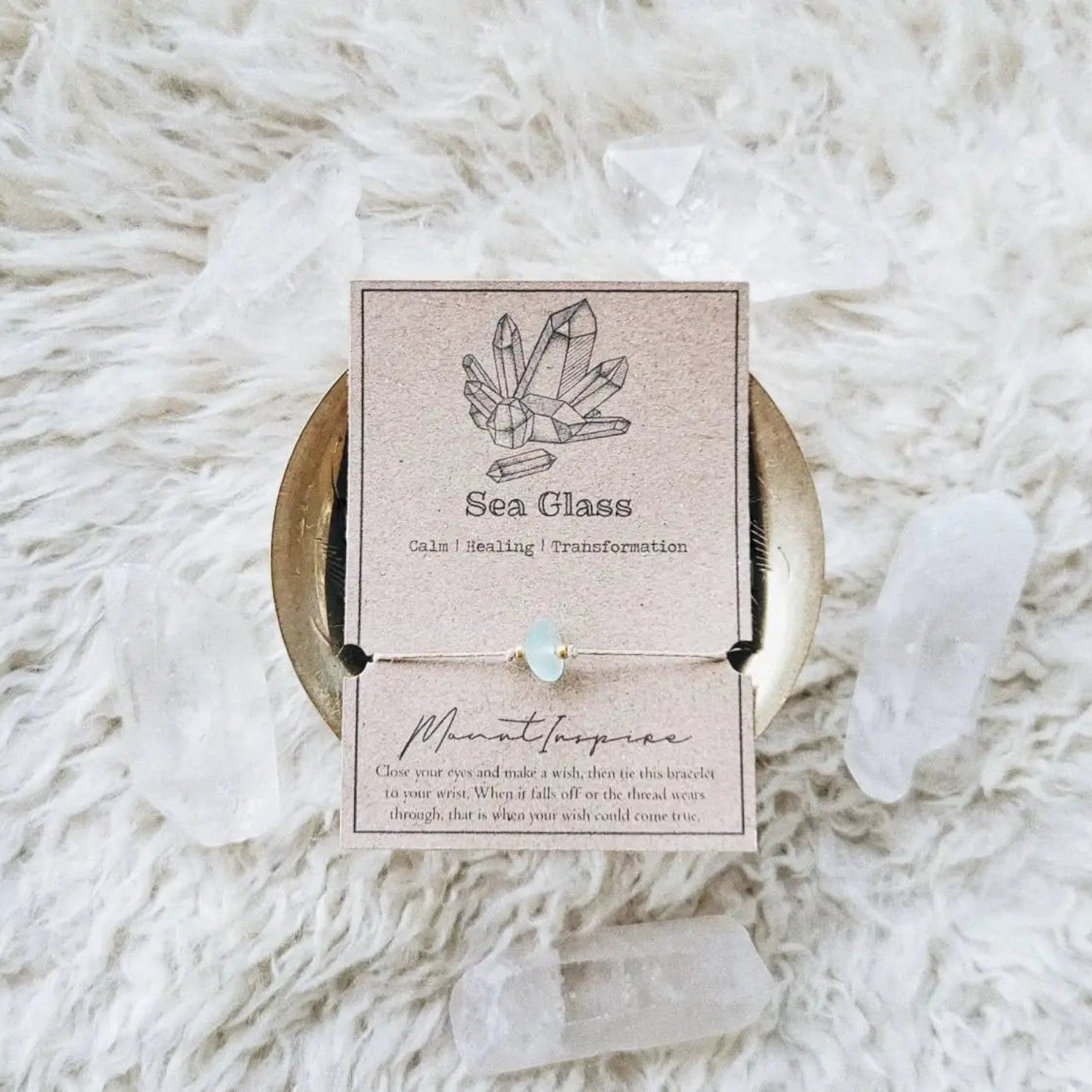 Mellow Monkey sea glass crystal wish bracelet on a kraft paper card with gold beads and natural tan hemp cord
