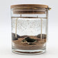 Mellow Monkey Sea Turtle Ocean gel candle with double wicks, sand, seashells, and a wooden lid in a glass jar.