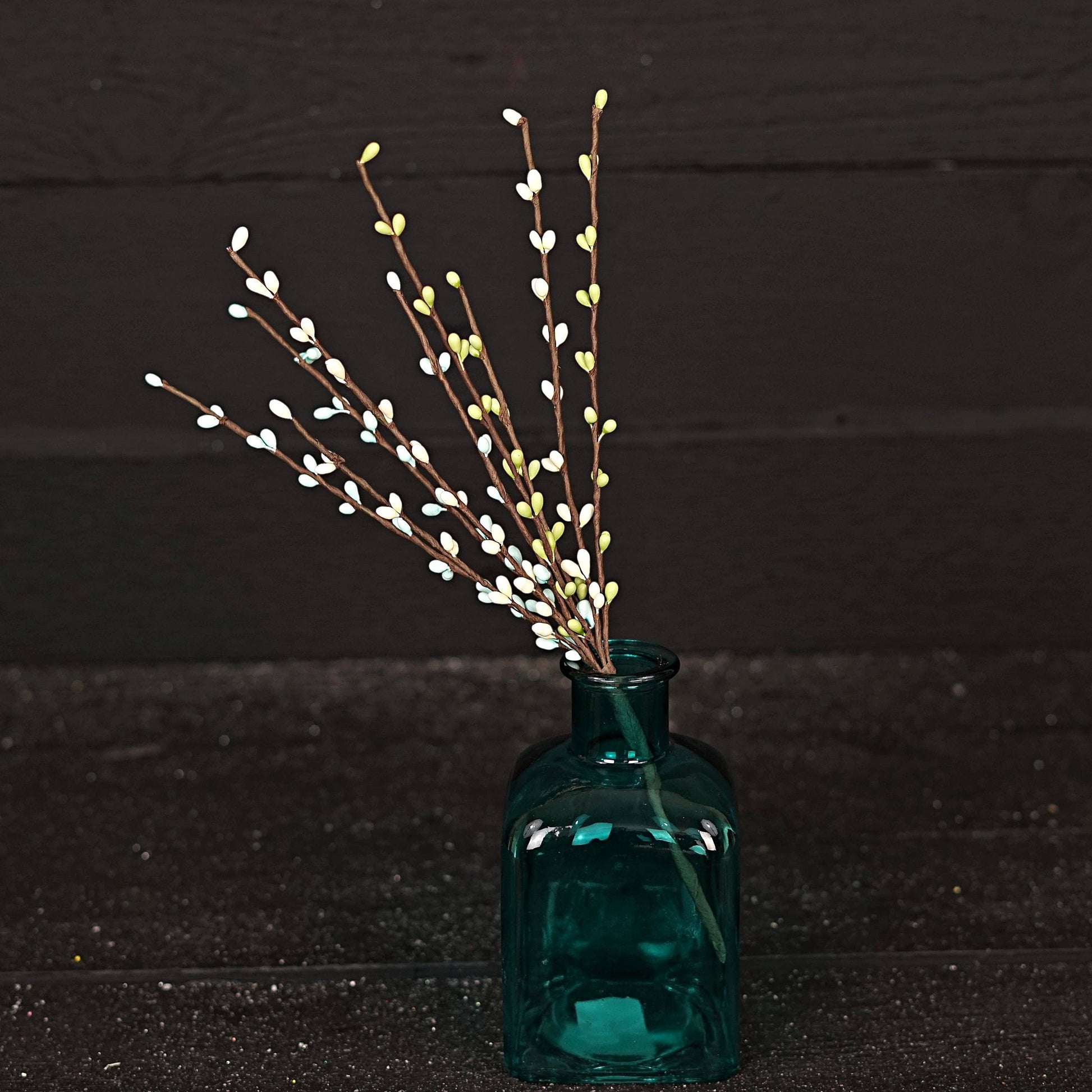 Mellow Monkey 12-inch Seabreeze pip berry pick with white and green berries on brown stems in a teal glass vase.