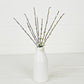 Mellow Monkey 12-inch Seabreeze pip berry pick with blue, green, and white berries on brown stems in a white vase.
