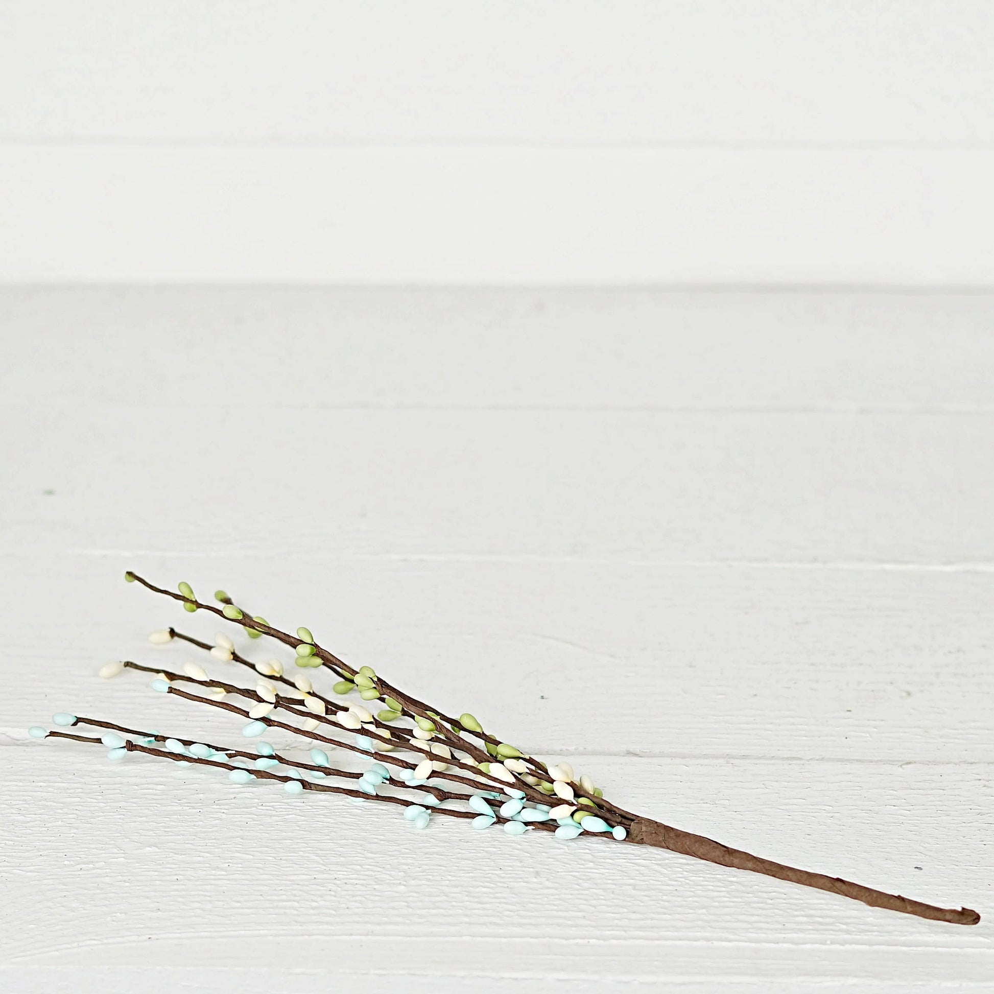 Mellow Monkey 12-inch Seabreeze pip berry pick with blue, green, and white berries on brown stems for spring decor.