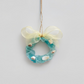 Mellow Monkey mini seaglass wreath ornament in teal and white with a sheer lace bow and rustic twine hanging loop