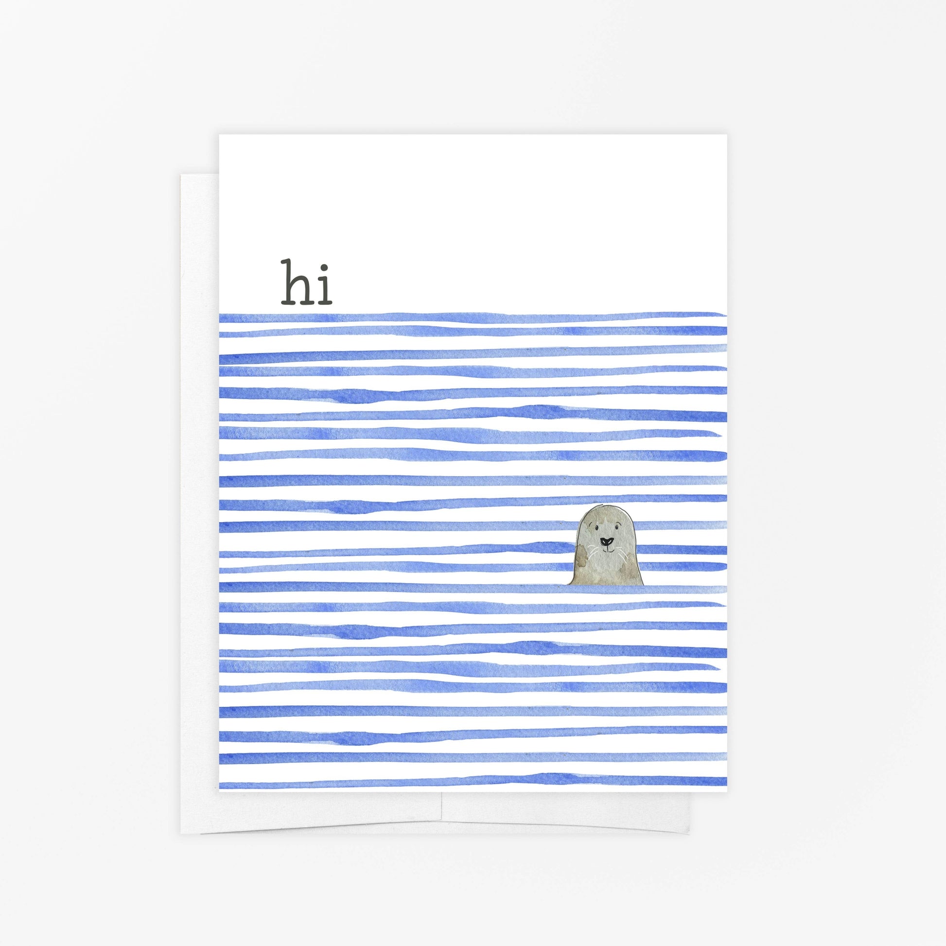 Mellow Monkey greeting card with a cute seal peeking out from blue watercolor stripes. Reads 'hi'. Blank inside.