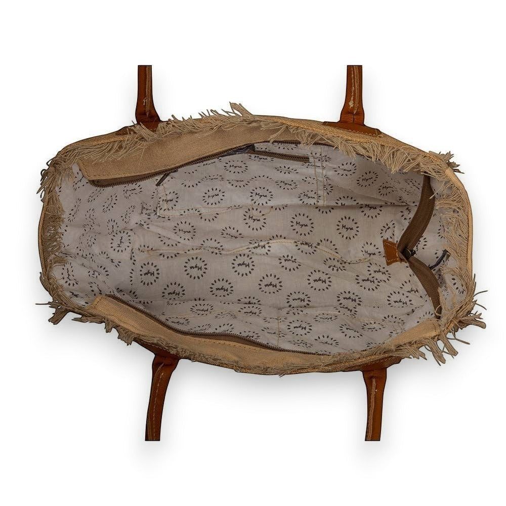 Mellow Monkey Sel De Mer bag interior view showing patterned fabric lining, zipper pocket, and frayed canvas edges.