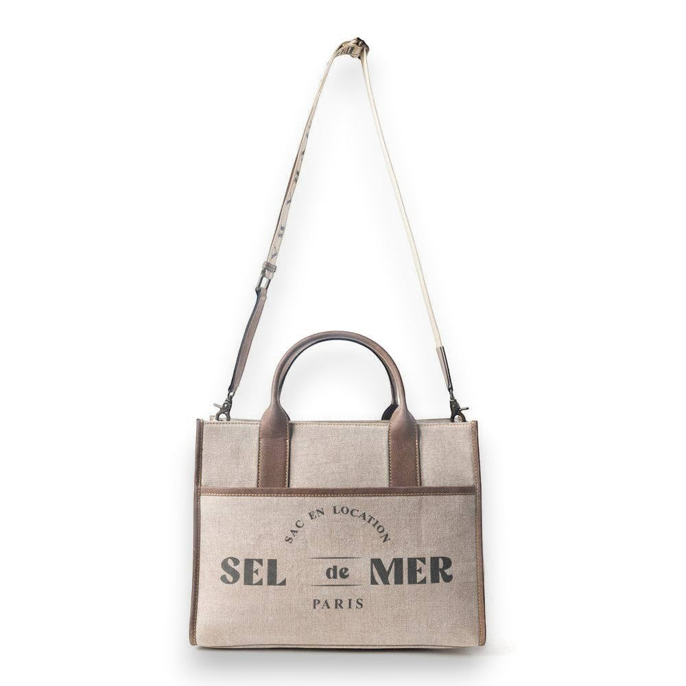 Mellow Monkey Sel de Mer shoulder bag in old mill white up-cycled canvas with brown leather trim and Parisian print.