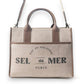 Mellow Monkey Sel de Mer shoulder bag in old mill white up-cycled canvas with brown leather trim and Parisian print