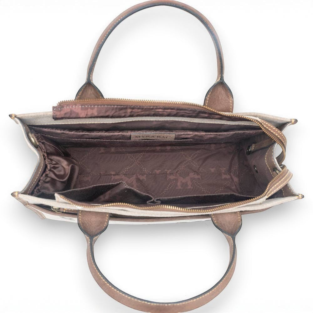 Mellow Monkey Sel de Mer shoulder bag in old mill white, showing the open interior with brown lining and leather trim.