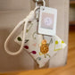 Mellow Monkey Carry Your Calm sensory fidget bag charm with turtle charm and card holder attached to a tote bag