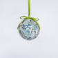 Mellow Monkey decoupage shell trio ornament featuring blue and white abstract art with a green ribbon hanger