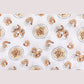 Mellow Monkey muslin swaddle blanket featuring a playful shrimp and grits pattern on a soft white fabric background.