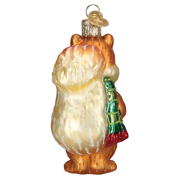 Mellow Monkey Silly Christmas Squirrel blown glass ornament, wearing a green and red scarf and holding a gift.