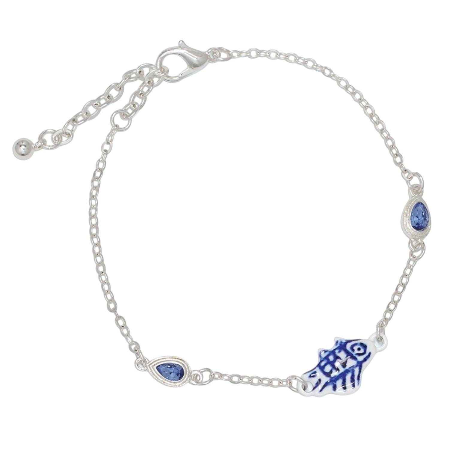 Mellow Monkey silver anklet featuring a blue and white enamel fish charm and two teardrop blue crystal accents.