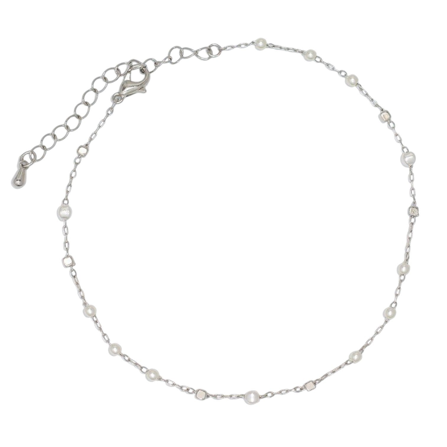 Mellow Monkey silver anklet featuring delicate pearl stations and a secure lobster clasp for a coastal beachy look.