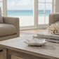 Mellow Monkey silver anklet with delicate pearl stations resting in a white starfish dish on a coastal table.