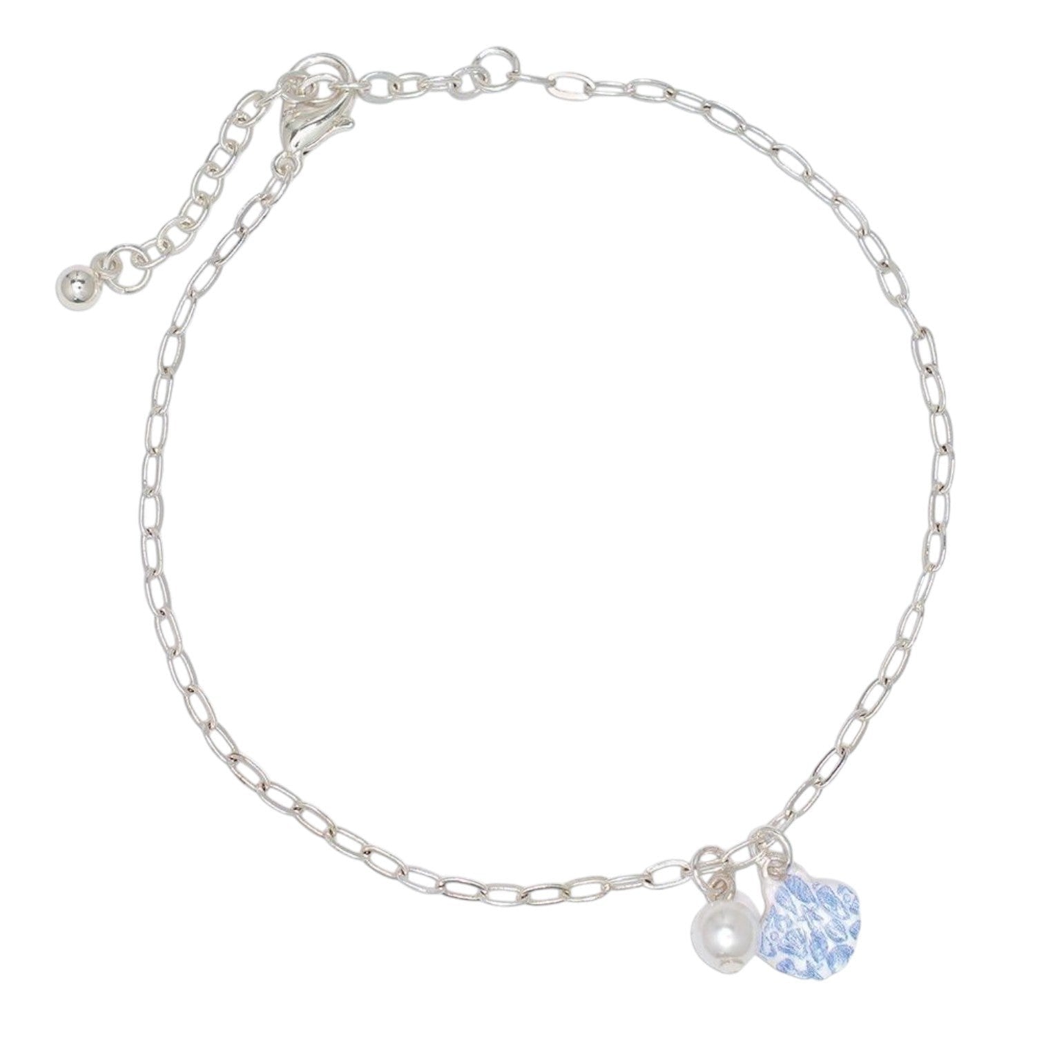 Mellow Monkey silver chain anklet featuring a white scallop shell charm and a small pearl bead on a delicate link