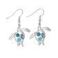 Mellow Monkey silver turtle earrings featuring blue and purple crystal accents for a coastal beachy style.