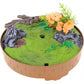 Mellow Monkey motion-activated singing bird base with green grass, faux rocks, a branch, and orange flowers.